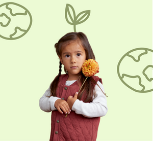 Girl wearing organic cotton vest from Nature Baby surrounded by images of earth.